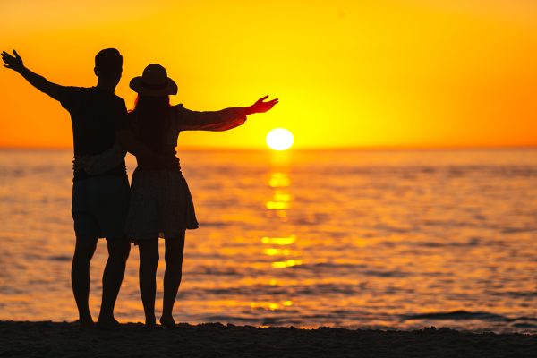 Romantic couple in love on the beach on romantic honeymoon travel